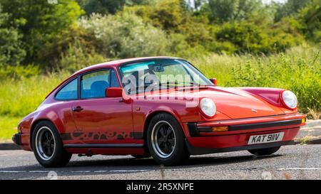 Stony Stratford,UK - June 4th 2023: 1979 red PORSCHE 911 Carrera  classic car travelling on an English country road. Stock Photo