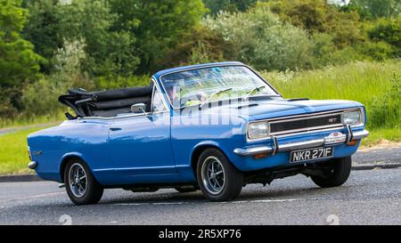 Stony Stratford,UK - June 4th 2023:  1968 blue Vauxhall Viva HB 2.0 GT Convertible classic car travelling on an English country road. Stock Photo