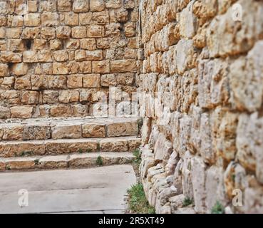 Stone wall of an ancient castle, background texture Stock Photo