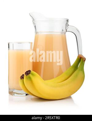 Full glass and jug of banana juice and fruits isolated on white background Stock Photo