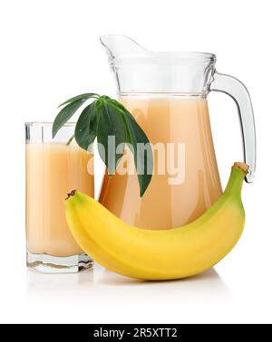 Full glass and jug of banana juice and fruits isolated on white background Stock Photo