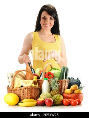 Young woman with groceries in wicker basket isolated on white Stock Photo