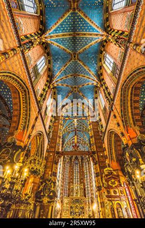 Altar Crucifix Cross Ceiling Triptych St Mary's Basilica Church Krakow Poland. Buit first in 1300s and the interior in 1700s Stock Photo