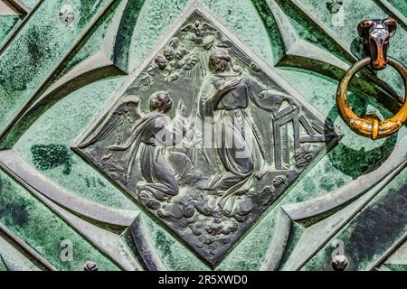 Door Annunciation Image St Mary's Basilica Church Krakow Poland. Buit in 1300s. Annunciation is when Angel Gabriel tells Mary she will have a son by h Stock Photo