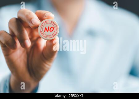 Concept of choice no on wooden cubic blocks. Think with Yes or No choice, Business choices for difficult situations, Business woman hands holding wood Stock Photo