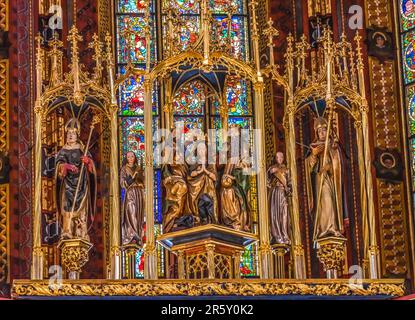 Mary Jesus God Statues Altar Stained Glass St Mary's Basilica Church Krakow Poland. Buit first in 1300s and the interior in 1700s Stock Photo