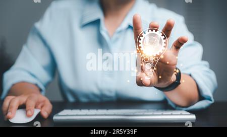 Hands holding light bulb for Concept new idea concept. Innovation and inspiration, innovative technology in science and communication idea. intelligen Stock Photo