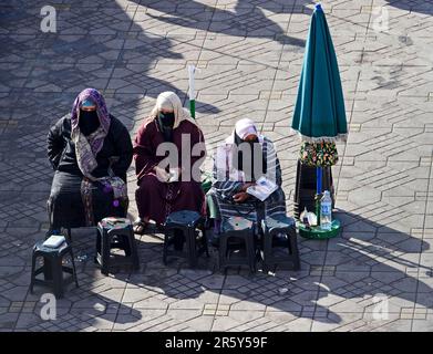 Morocco, Veiled Women, Hand Painting, Place Djemaa El Fna, Marrakech Stock Photo
