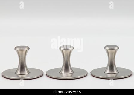 Adhesive holders in stainless steel. Self adhesive hooks isolated on white background. Stock Photo