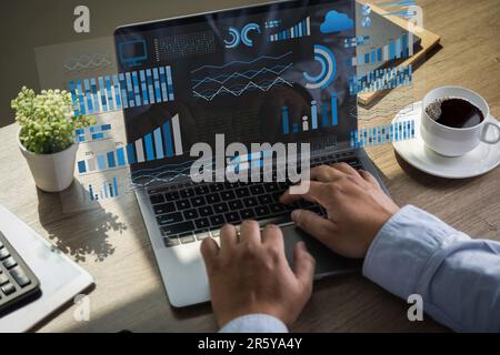 analyst uses a computer and dashboard Data Management System project analysis resource financial graph business performance on the desktop Stock Photo