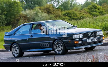 Stony Stratford,UK - June 4th 2023: 1989 AUDI QUATTRO classic car travelling on an English country road. Stock Photo