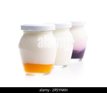 White and fruity yogurt in jar isolated on the white background. Stock Photo