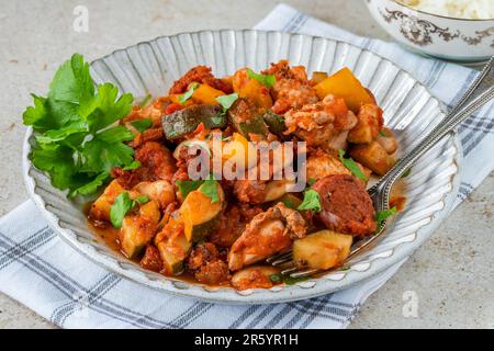 Spanish chicken stew with red wine, chorizo and vegetables Stock Photo