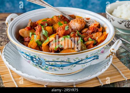 Spanish chicken stew with red wine, chorizo and vegetables Stock Photo