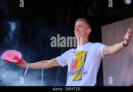 04 June 2023, Saxony, Leipzig: Soccer: DFB Cup, after the final, RB Leipzig - Eintracht Frankfurt. Leipzig's player Dani Olmo arrives for the victory celebration on the festival lawn in front of the stadium. RB Leipzig won the DFB Cup final for the second time the night before (3.6.). Photo: Jan Woitas/dpa - IMPORTANT NOTE: In accordance with the requirements of the DFL Deutsche Fußball Liga and the DFB Deutscher Fußball-Bund, it is prohibited to use or have used photographs taken in the stadium and/or of the match in the form of sequence pictures and/or video-like photo series. Stock Photo