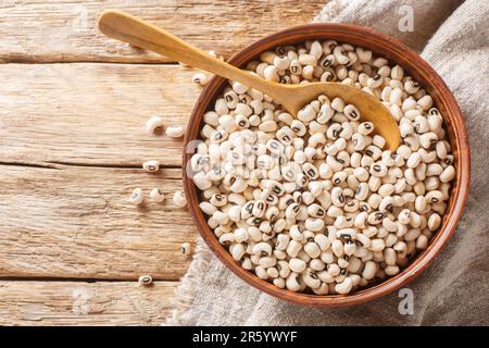 Black eye bean Vigna unguiculata closeup on the bowl. Horizontal top view from above Stock Photo