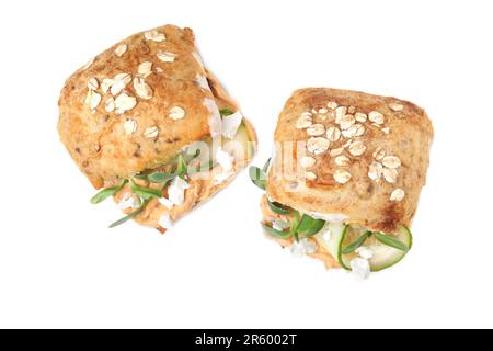 Delicious sandwiches with hummus, microgreens and cucumber slices isolated on white, top view Stock Photo