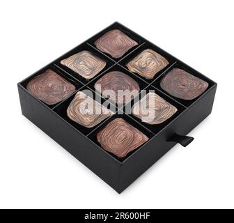 Box of delicious chocolate candies isolated on white Stock Photo