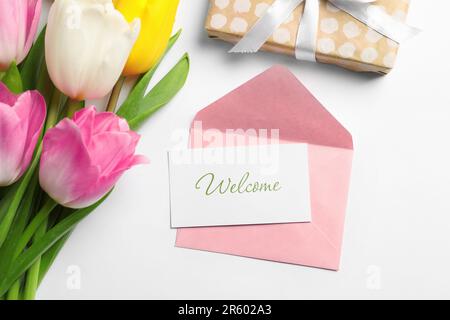 Composition with envelope, beautiful flowers and word MARCH on yellow ...