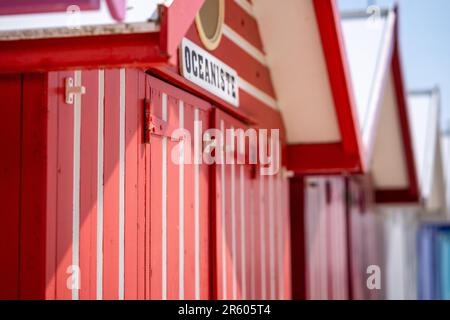 Wooden colorful beach huts at the northern French beach Stock Photo