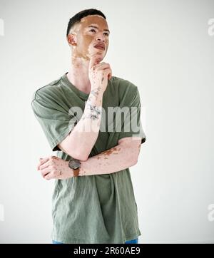 Memory, man against a white background and thinking for problem solving. Remember or thoughtful ideas, solution or contemplating and young male person Stock Photo