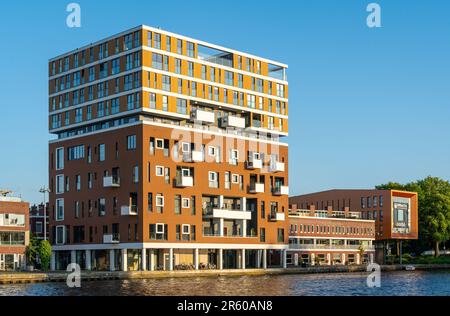 Haarlem, The Netherlands, 02.06.2023, Modern residential tower on Spaarne river in Haarlem called 'Fabrilo' Stock Photo
