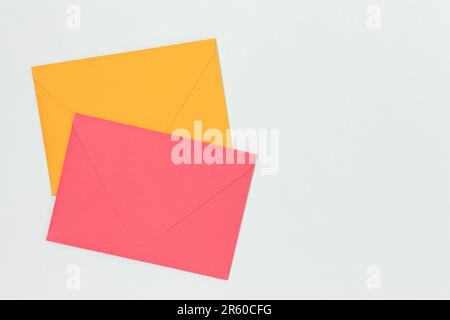 Multicolored envelopes on a blue background. Minimal concept with copy space. Stock Photo