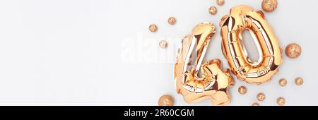 Banner with number 40 golden air balloons with round confetti on a blue background. Stock Photo