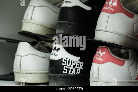 10 July 2022 Eskisehir Turkey. Three pair of Adidas superstar shoes on the shelf Stock Photo