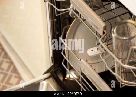 Dirty dishes in the dishwasher close up view Stock Photo