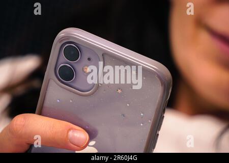 28 July 2022 Eskisehir Turkey. Purple iphone 11 in woman hand close up view Stock Photo