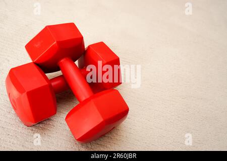 Set of red dumbbells on isolated background Stock Photo