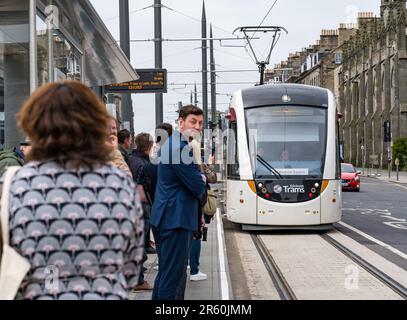 Edinburgh, Scotland, UK, 06 June 2023. Trams to Newhaven: After 3.5 years the extension to the capital city’s tram line has a special press trip from Picardy Place to Newhaven ahead of welcoming passengers from noon tomorrow. Trams to Newhaven adds 2.91 miles of track connecting Leith and Newhaven to the current end of the Edinburgh tram line at York Place with 8 new stops. Pictured: Council Leader Cammy Day waits for the first tram to take passengers. Credit: Sally Anderson/Alamy Live News Stock Photo