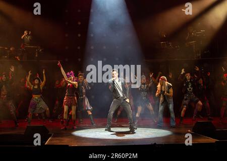 front centre, l-r: Elena Skye (Scaramouche), Ian McIntosh (Galileo Figaro), Ben Elton (The Rebel Leader) in WE WILL ROCK YOU at the London Coliseum, London WC2  07/06/2023 music & lyrics by Queen  story & script: Ben Elton  set design: Stufish Entertainment Architects  costumes & wigs: Kentaur  lighting: Luke Rolls  musical staging: Jacob Fearey  director: Ben Elton Stock Photo