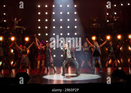 front centre, l-r: Elena Skye (Scaramouche), Ian McIntosh (Galileo Figaro), Ben Elton (The Rebel Leader) in WE WILL ROCK YOU at the London Coliseum, London WC2  07/06/2023 music & lyrics by Queen  story & script: Ben Elton  set design: Stufish Entertainment Architects  costumes & wigs: Kentaur  lighting: Luke Rolls  musical staging: Jacob Fearey  director: Ben Elton Stock Photo