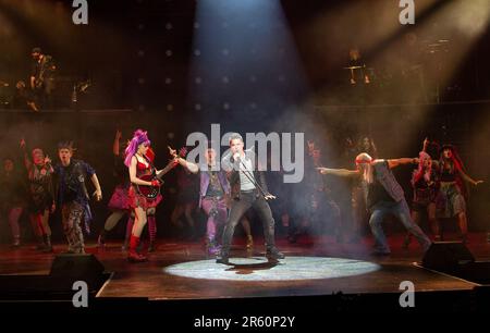 front centre, l-r: Elena Skye (Scaramouche), Ian McIntosh (Galileo Figaro), Ben Elton (The Rebel Leader) in WE WILL ROCK YOU at the London Coliseum, London WC2  07/06/2023 music & lyrics by Queen  story & script: Ben Elton  set design: Stufish Entertainment Architects  costumes & wigs: Kentaur  lighting: Luke Rolls  musical staging: Jacob Fearey  director: Ben Elton Stock Photo