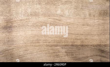Light brown rough grainy mango wood texture background Stock Photo