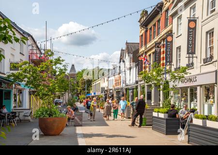 People enjoying the summer sunshine in the recently pedestrianised  high Street of the South Wales market town of Abergavenny Monmouthshire Stock Photo