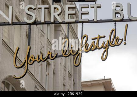 3d Signs Your Lifestyle Hanging Over Fashion Street Stock Photo