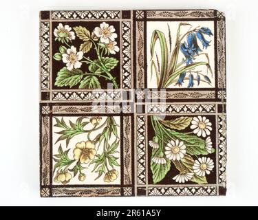 Antique 1890s Victorian hand coloured transfer printed wild flower pottery tile Stock Photo