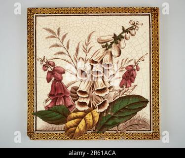 Antique 1890s Victorian hand coloured transfer printed foxglove pottery tile Stock Photo