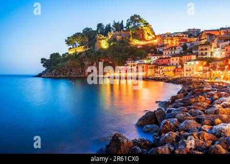 Parga, Greece. Beautiful colorful coastal town in Epirus, Greek holidays. Blue hour sunset illuminated oldtown. Stock Photo