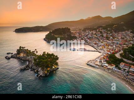 Parga, Greece. Beautiful colorful coastal town in Epirus, Greek holidays. Sunset aerial view. Stock Photo