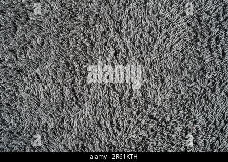 Gray background from microfiber fabric, idea for wallpaper or screen about materials. Synthetic matter Stock Photo