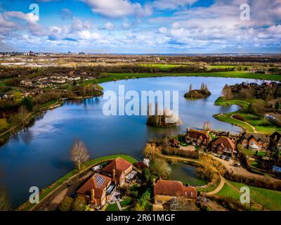 An aerial view of a town situated near a river in Milton Keynes Stock Photo