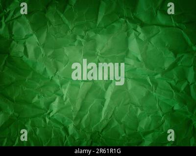 A crumpled green paper background. Close up. Stock Photo