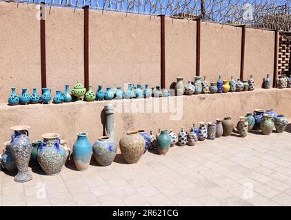 Traditional iranian souvenirs - colorful clay pots and jugs, Yazd, Iran Stock Photo