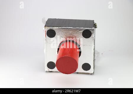 Tactile push button of a very large size made from cardboard and paper as a science fair project isolated on white background Stock Photo
