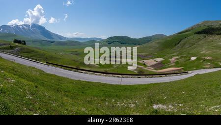 Panoramic view of the Piano Grande plateau in the central Italian Apennine mountains during May, Italy, Europe Stock Photo