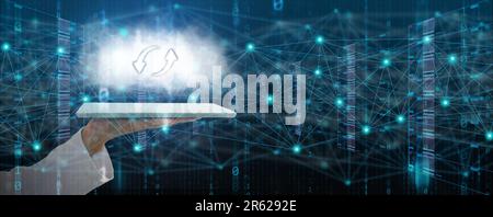 Information technology concept. A man's hand uses a tablet to create, process, store, retrieve, exchange, and connect to data and digital information Stock Photo